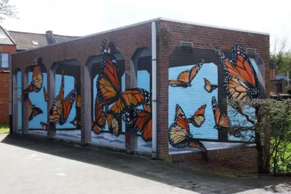 MUURSCHILDERINGEN AAN GOOSSENVEST EN REIZIGERSSTRAAT
